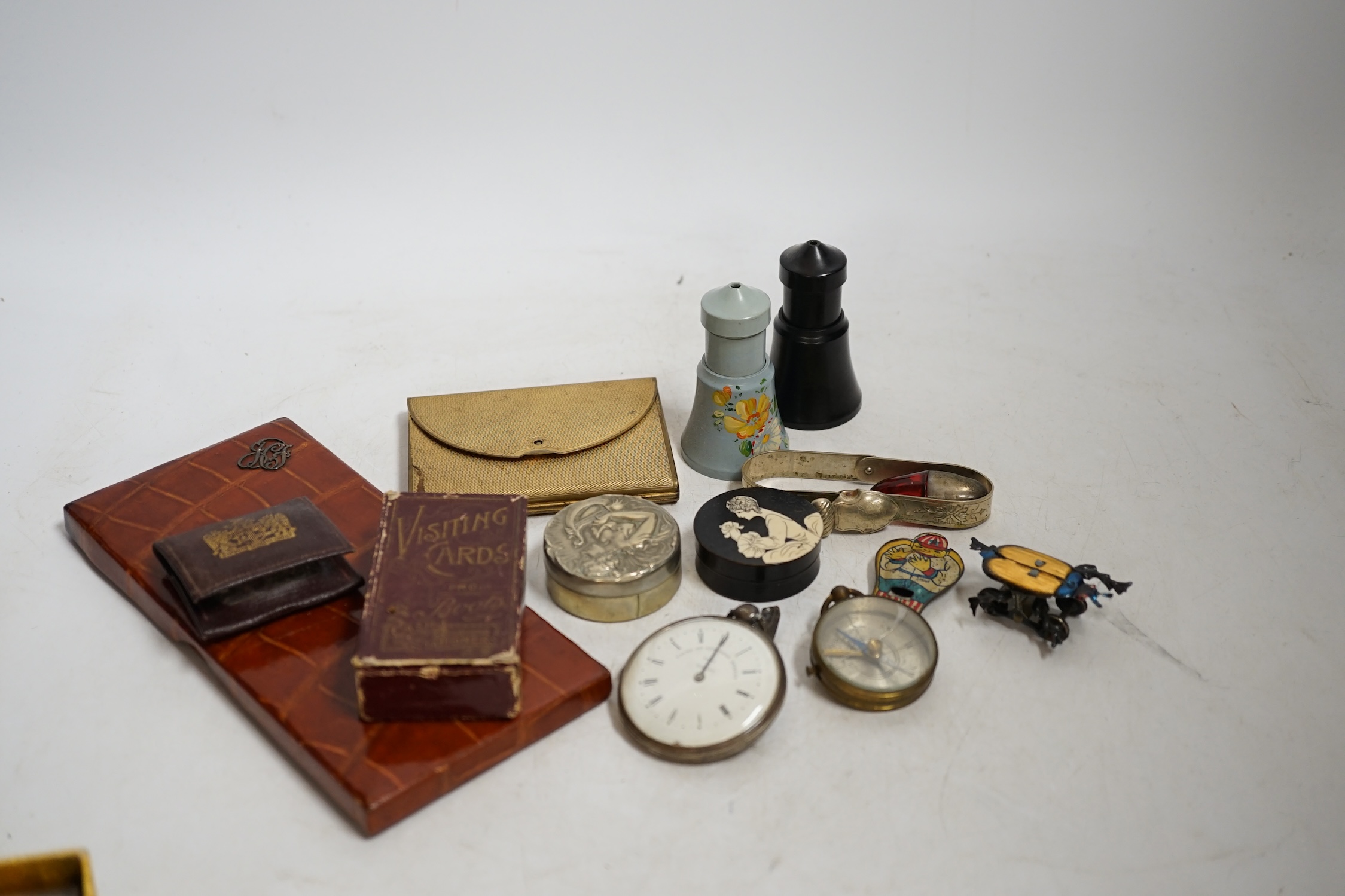 A group of mixed collectables and objects to include Bakelite boxes, pen knives, white metal charms and a gilt metal compact, etc. Condition - varies, fair